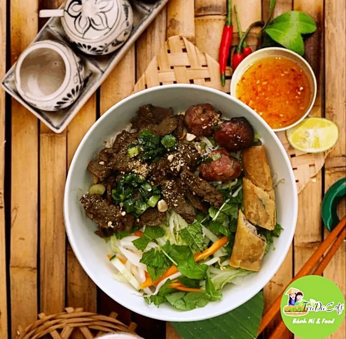Vermicelli bowl with grilled pork and egg roll
